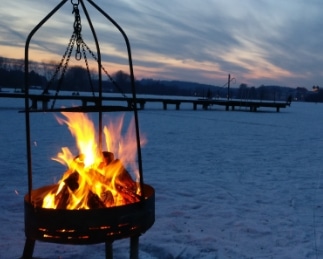 Communal fire pit with Lake Simcoe ice fishing